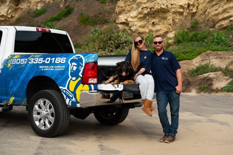TLC Handyman service truck with client in front